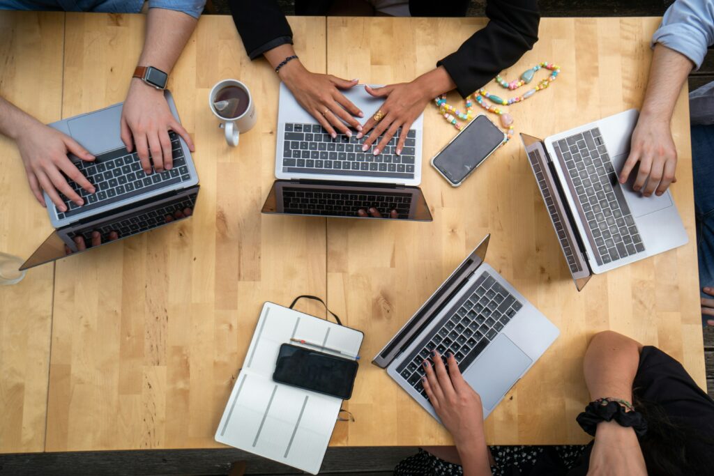 A group of people using laptops