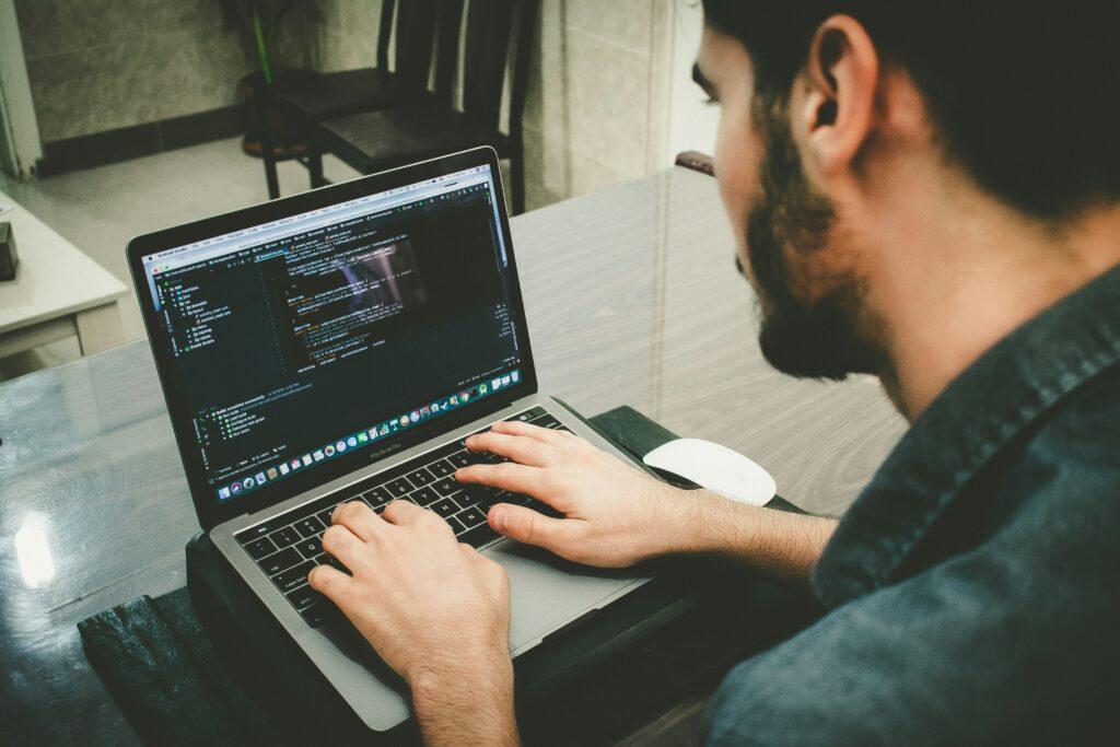 A programmer using a laptop