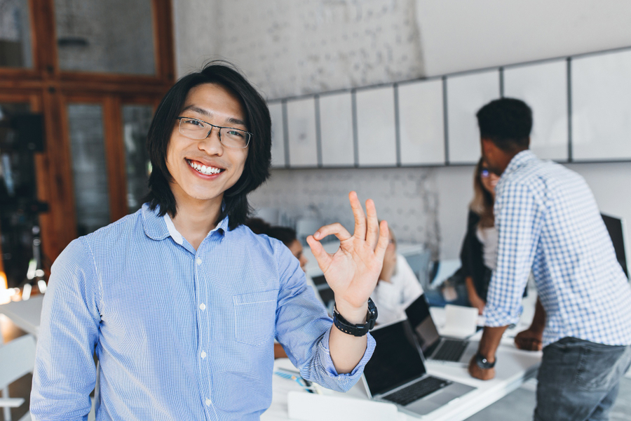 An IT specialist showing OK hand sign